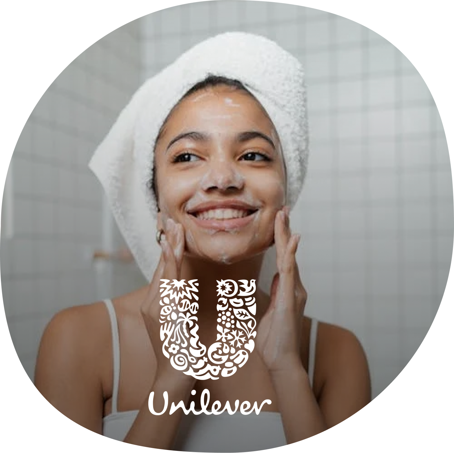 Girl cleaning her face with unilever logo