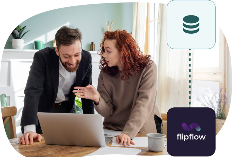 Two colleagues working together at a laptop. The woman is gesturing and discussing something with the man, who is smiling. The image includes icons: a database symbol at the top and the 'flipflow' logo in the bottom right corner.